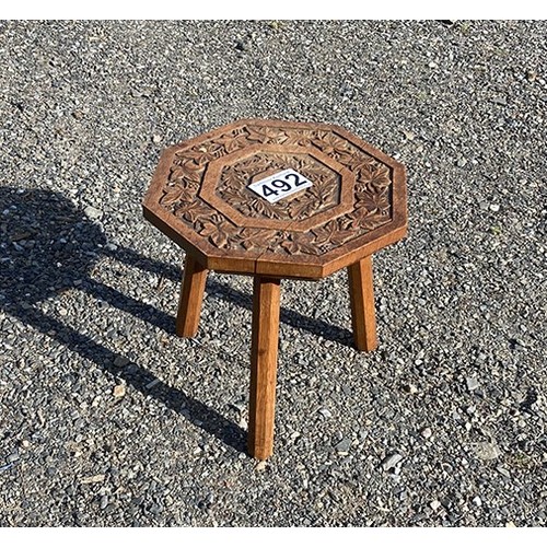 492 - Small carved wooden three-legged stool