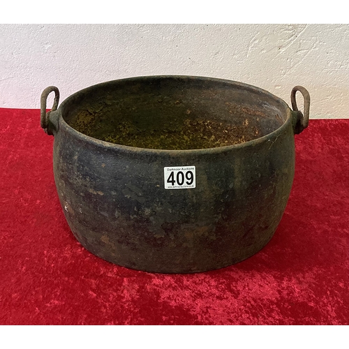 409 - Large iron Cauldron/Cooking Pot with West Bromwich maker's mark. Approximately 18 x 13 x 11.5 inches... 