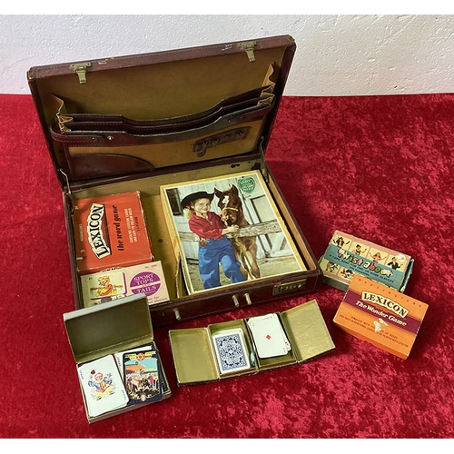 416 - Vintage leather briefcase a/f containing a vintage Victory wooden jigsaw and vintage card games