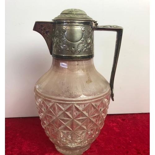 55 - Antique glass claret jug with silver plated lid