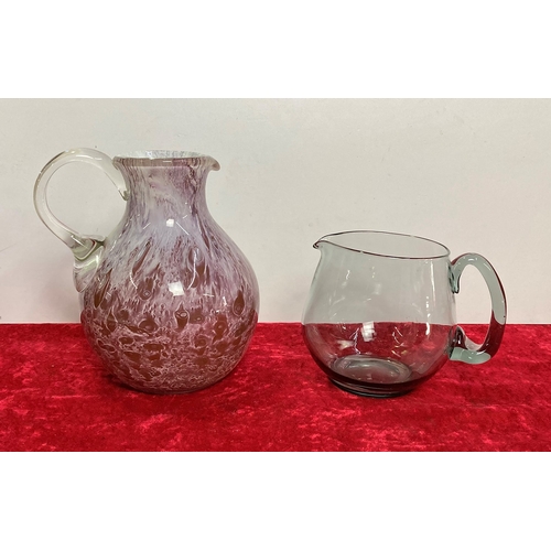 105 - Large reverse painted glass jug and a plain glass jug.
