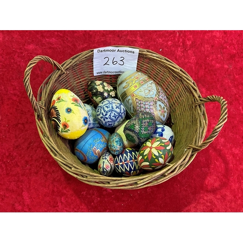 263 - Basket of tin, wood, ceramic and other painted eggs