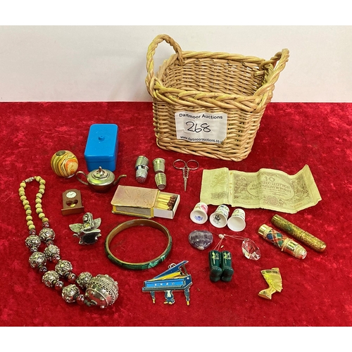 268 - Small basket of collectibles including costume jewellery, copper matchbox holder, thimbles etc