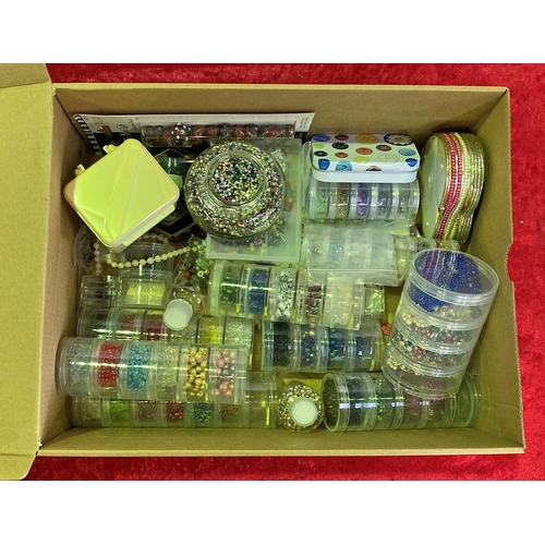 323 - A box of beads and sequins