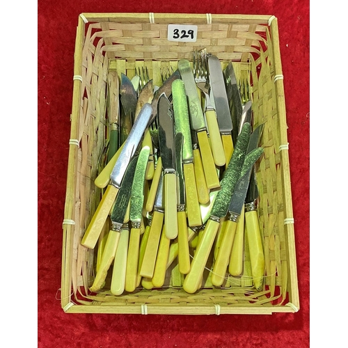 329 - A quantity of vintage cutlery