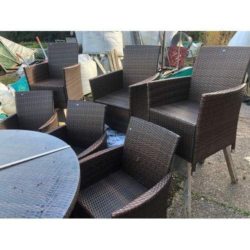 8 - Very large glass topped rattan garden table (a/f) with eight chairs in good condition with outdoor c... 