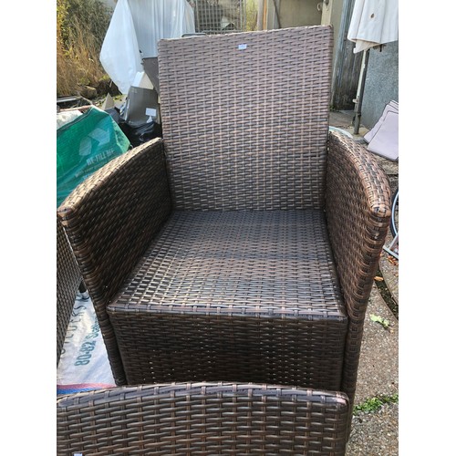 8 - Very large glass topped rattan garden table (a/f) with eight chairs in good condition with outdoor c... 