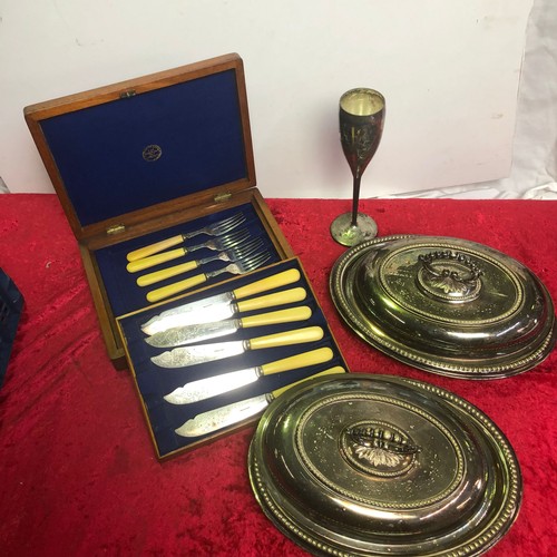 630 - Boxed silver plated fish knives, a silver plated goblet and two silver plated lidded servers