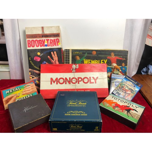 149 - Box of vintage board games inc. Monopoly, Wembley and Trivial Pursuit