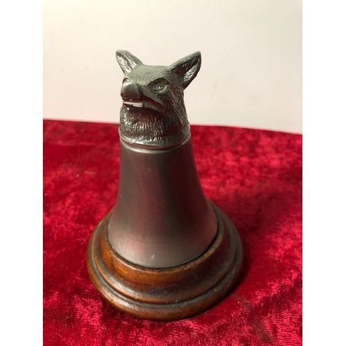 414 - Pewter fox head stirrup cup mounted on a mahogany base