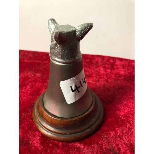 414 - Pewter fox head stirrup cup mounted on a mahogany base