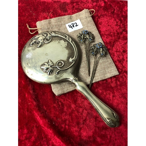 482 - Fantastic Dragon embossed looking glass, bevelled mirror, and 2 early 'Chignon' hair pins