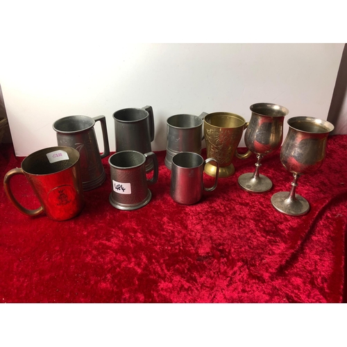 484 - A selection of Pewter, glass bottomed, brass and copper mugs and goblets