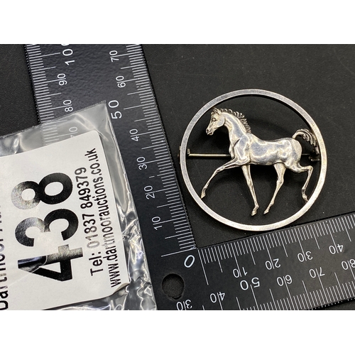 438 - Designer circular silver brooch depicting a prancing horse by George Tarratt