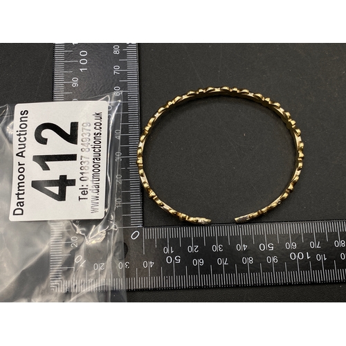 412 - Fancy knot design bangle, 14ct gold, 11g