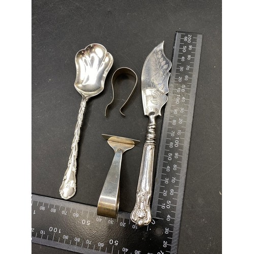 248 - Mixed lot of silver items including a spoon, fish knife, pusher and clip, all hall marked, 67g