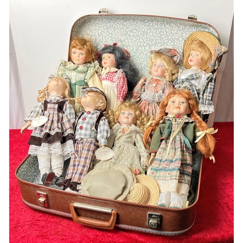 32 - Vintage suitcase with dolls on stands