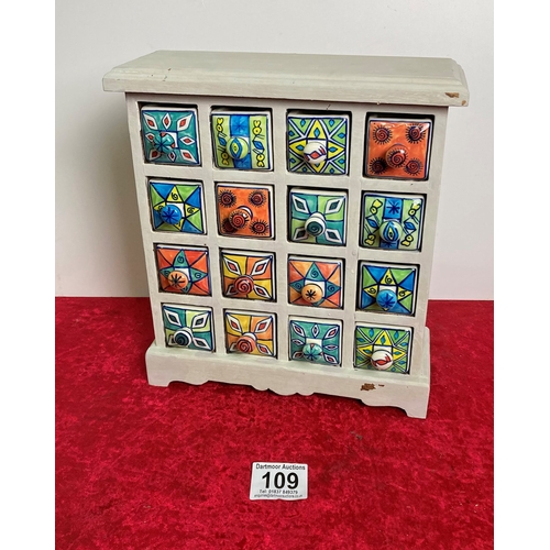 109 - Wooden spice rack with hand painted ceramic drawers