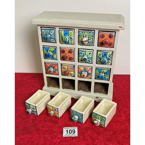 109 - Wooden spice rack with hand painted ceramic drawers