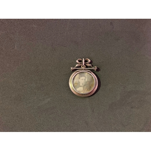 251 - Antique double memorial / mourning locket with paste surround on paste bow clip set in silver