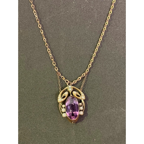 252 - Art Nouveau pearl and purple stone pendant on a metal chain