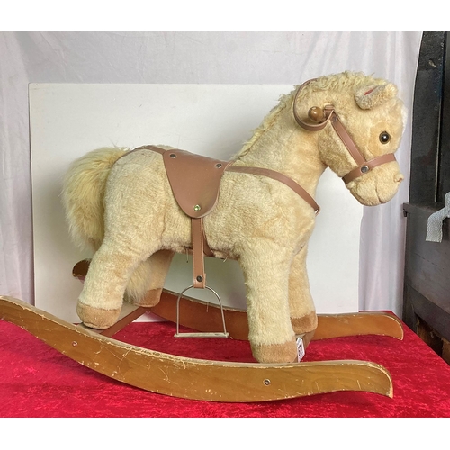 671 - Small plush rocking horse with very happy face and sound effects!