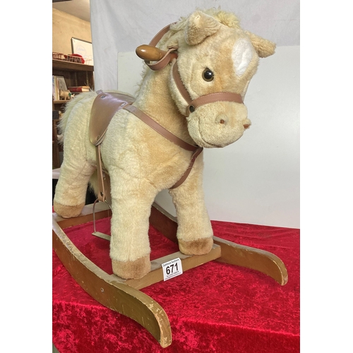 671 - Small plush rocking horse with very happy face and sound effects!