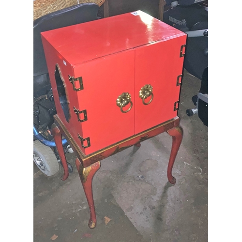 550 - Red Two door cupboard stand, oriental / chinese style . Approx 34inches tall x 18 inches wide and 12... 