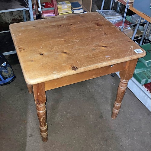 543 - Square pine table Measures 28 inches square, 30 inches high.