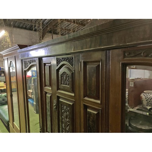 530 - Magnificent double wardrobe with drawers and linen press style cupboard with carved detail . Approx ... 