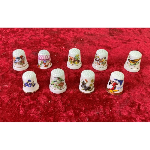 32 - 9 collectible china thimbles or alternatively very small shot glasses