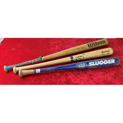 40d - Three baseball / softball bats including Wilson, Rawlings adn Louisville Slugger