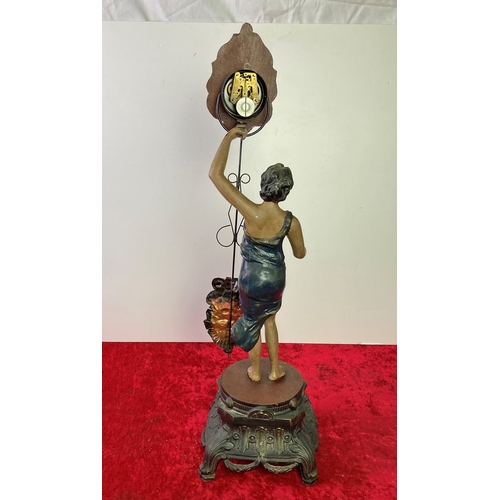 6 - Metal Art Deco styled figurine holding A clock movement