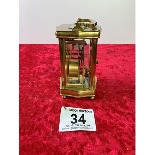 34 - Small French brass cased carriage clock with key