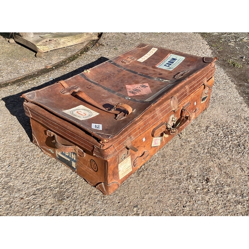 326 - A magnificent vintage leather suitcase with travelling labels and lovely patina - from the 1920's