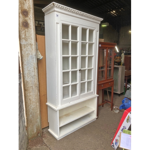 709 - Fabulous white painted wooden display cabinet with shelving underneath