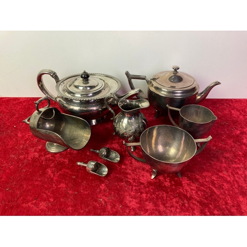 301 - A selection of silver plated items including  teapots and milk jugs