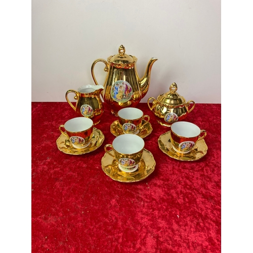 615 - A selection of Czech gold coloured coffee set, 4 cups and saucers, coffee pot, cram jug and sugar bo... 