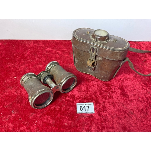 617 - A pair of cased Jockey Club binoculars with a compass inset to the lid