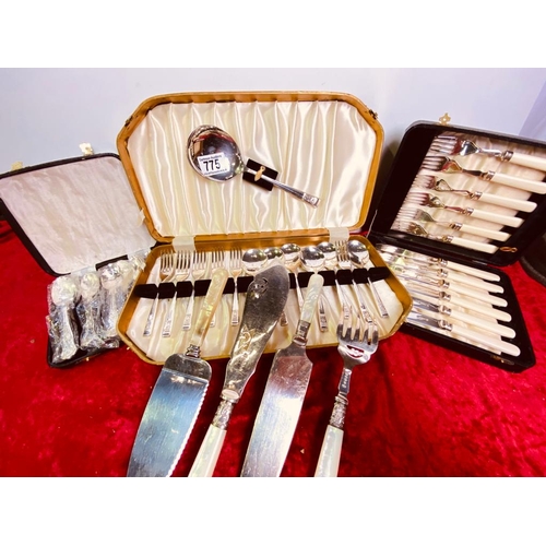 775 - An assorted box containing EPNS boxed fish knives and forks and a MOP cake slice set and a boxed des... 