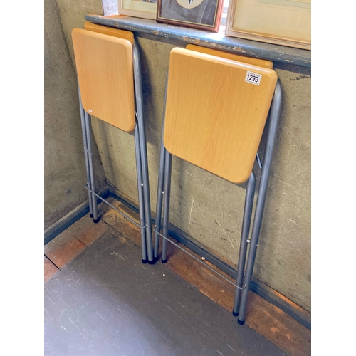 1299 - 2 metal and wood folding bar stools in good condition