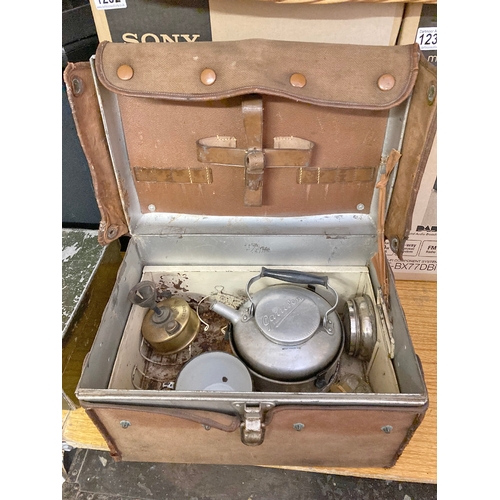 1234 - A vintage Garrison camping set in tinned case with crockery contents