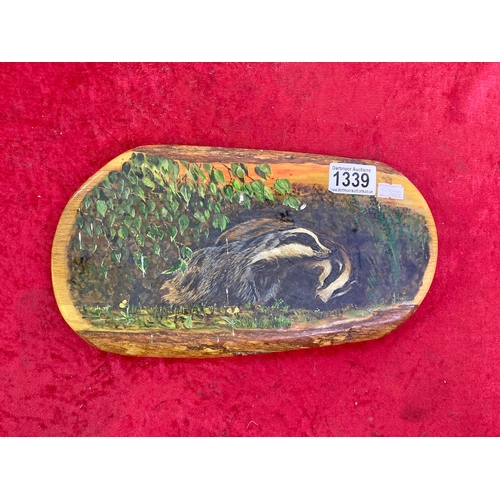 1339 - Painting of badgers on wooden plaque, signed J E Lynn