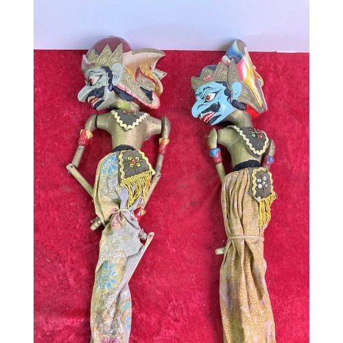 1132 - Two large Eastern style wooden hand-painted marionette puppets with cloth clothing