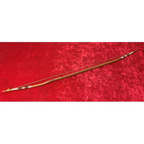 10 - 2 ethnic wooden spears along with a wooden bow