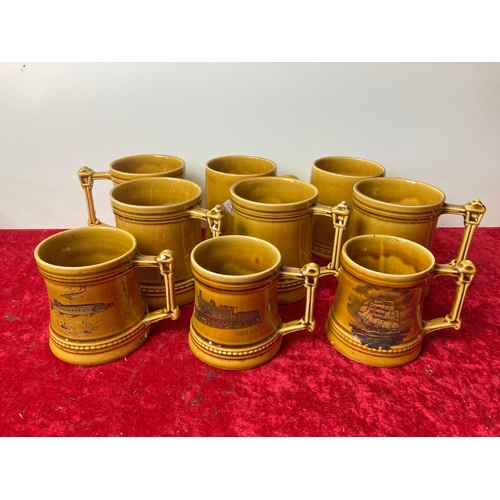 83 - A collection of mustard coloured china tankards