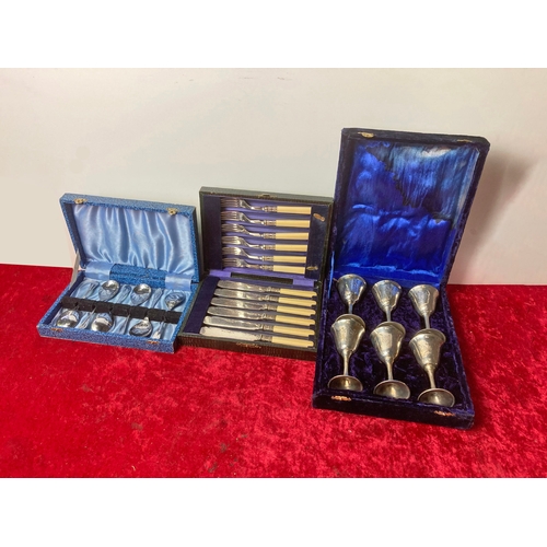 108 - Boxed metal goblets, fish knives and forks and spoons