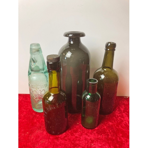 121 - Collectible vintage bottles including Bistombe Plymouth bottle with marble