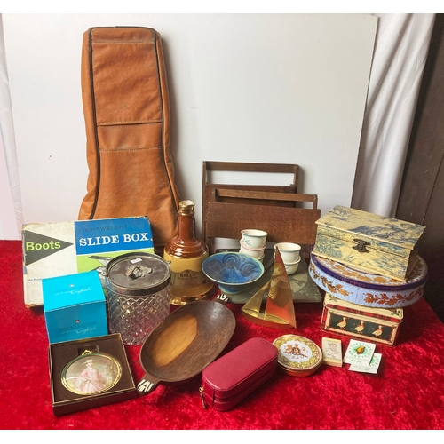 125 - A box of mixed collectibles including a slate clock, a bookstand, tins, coasters etc