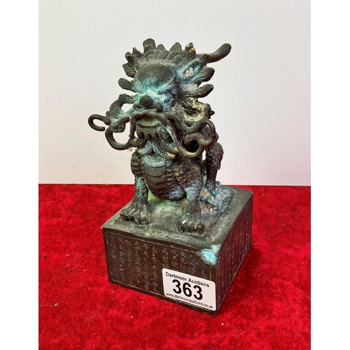 363 - A metal, Oriental Dragon figurine on a plinth